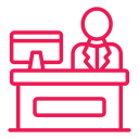 Pink line-style icon of a teacher at a desk representing a welcoming international environment.